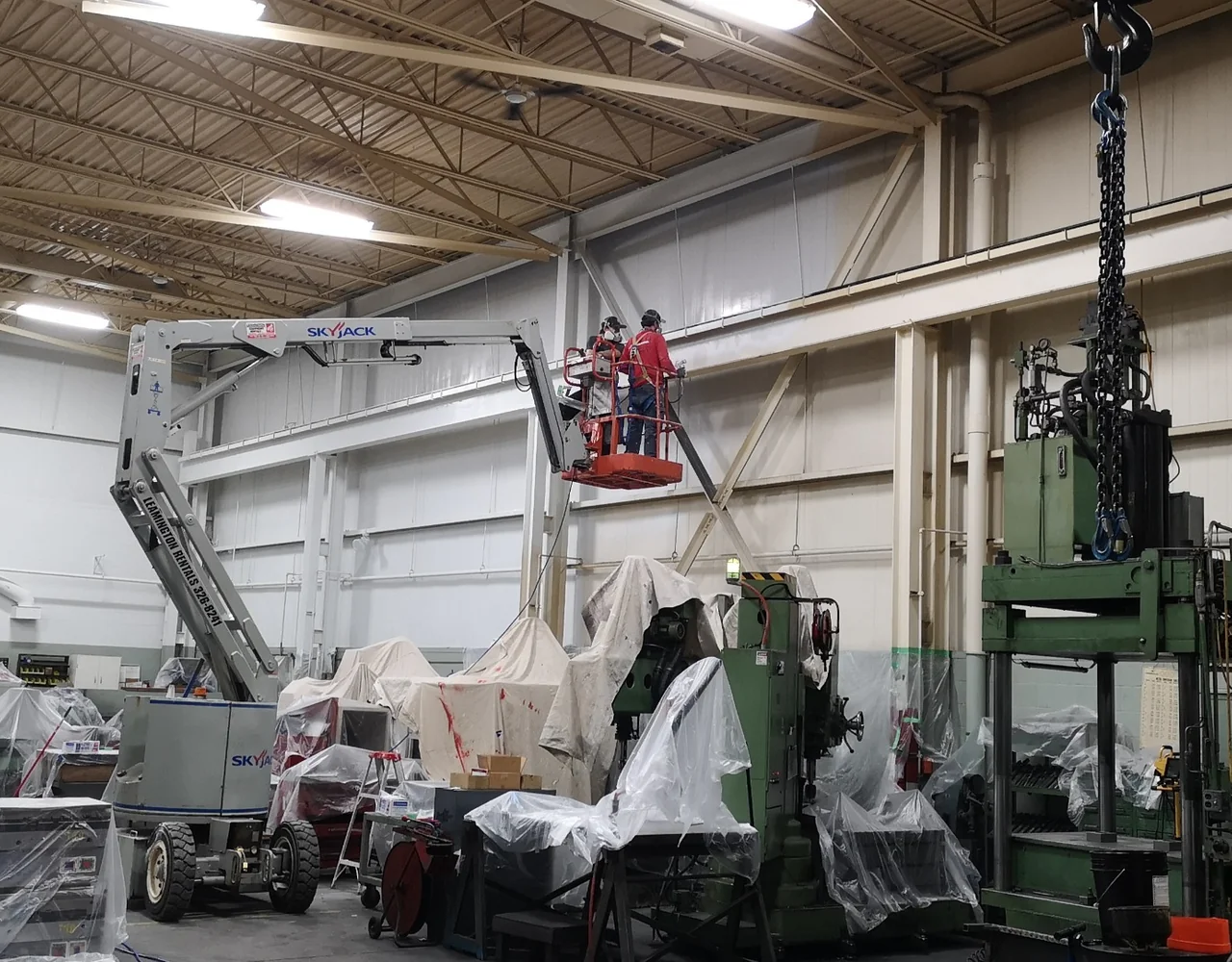 Industrial facility interior with freshly coated steel and safety-marked floors